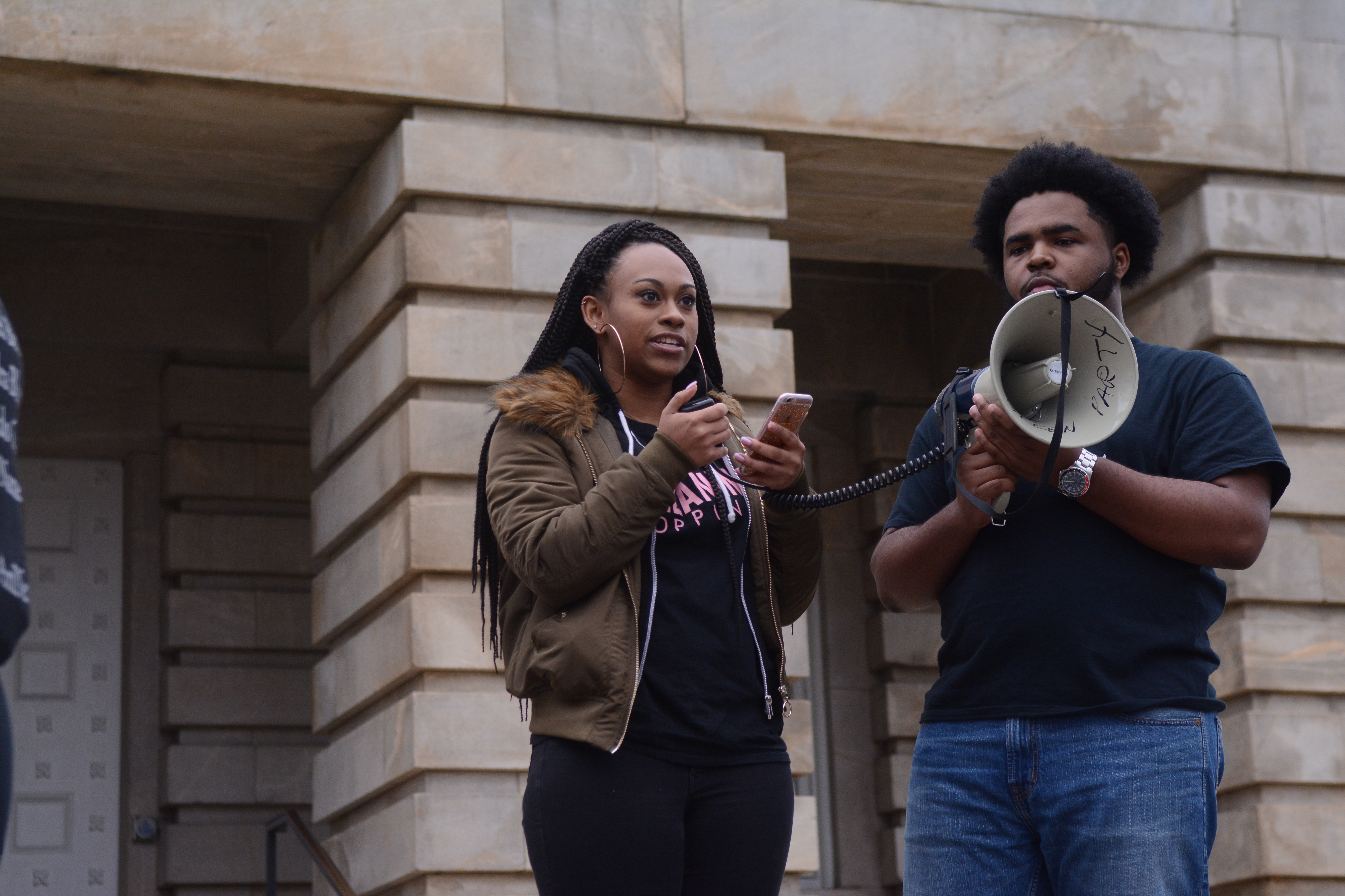 As part of the ReclaimMLK March at Raleigh on Jan. 16, 2017, Achaia Dent, a sophomore studying animal science, speaks in front of the North Carolina State Capitol building. Dent emphasized the legacy of Dr. Martin Luther King Jr. in her words, reading some of Dr. King's famous "I Have a Dream" speech, and urged the crowd to continue being active to fix issues minorities face.