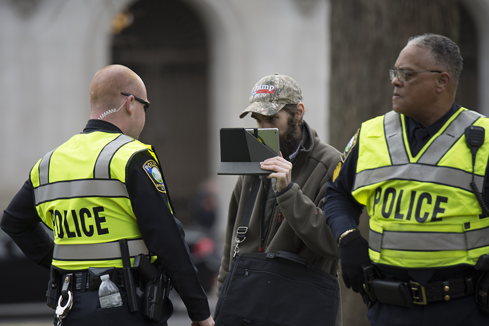 A counter-protester was escorted out of the event after disrupting the event at the Crush Confederates at the Capital event on Saturday, Feb. 9 at the North Carolina State Capitol in Raleigh. (Kaydee Gawlik/Nubian Message)