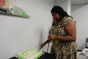woman cutting birthday cake
